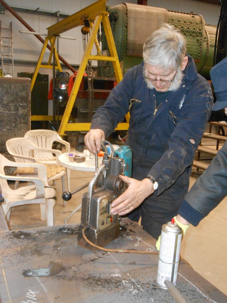 Alan drills holes in new running board for Caliban