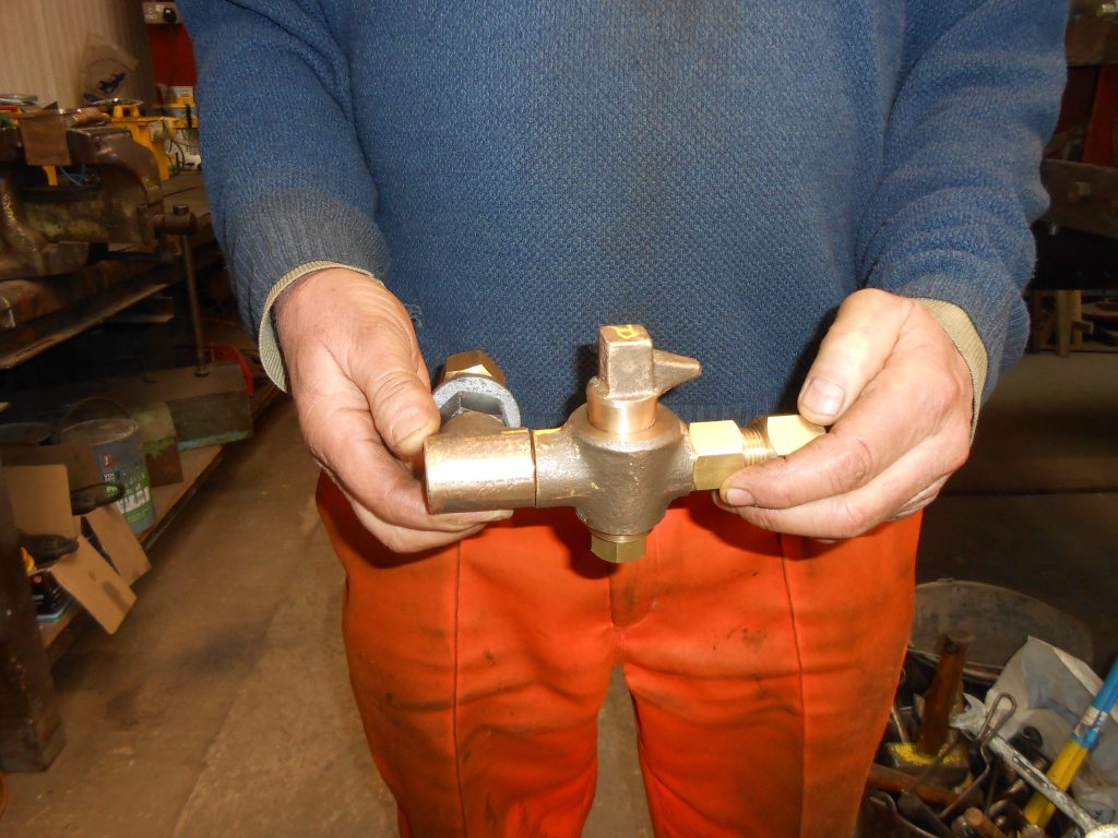 Keith holds one of Wootton Hall's new cylinder lubrication valves