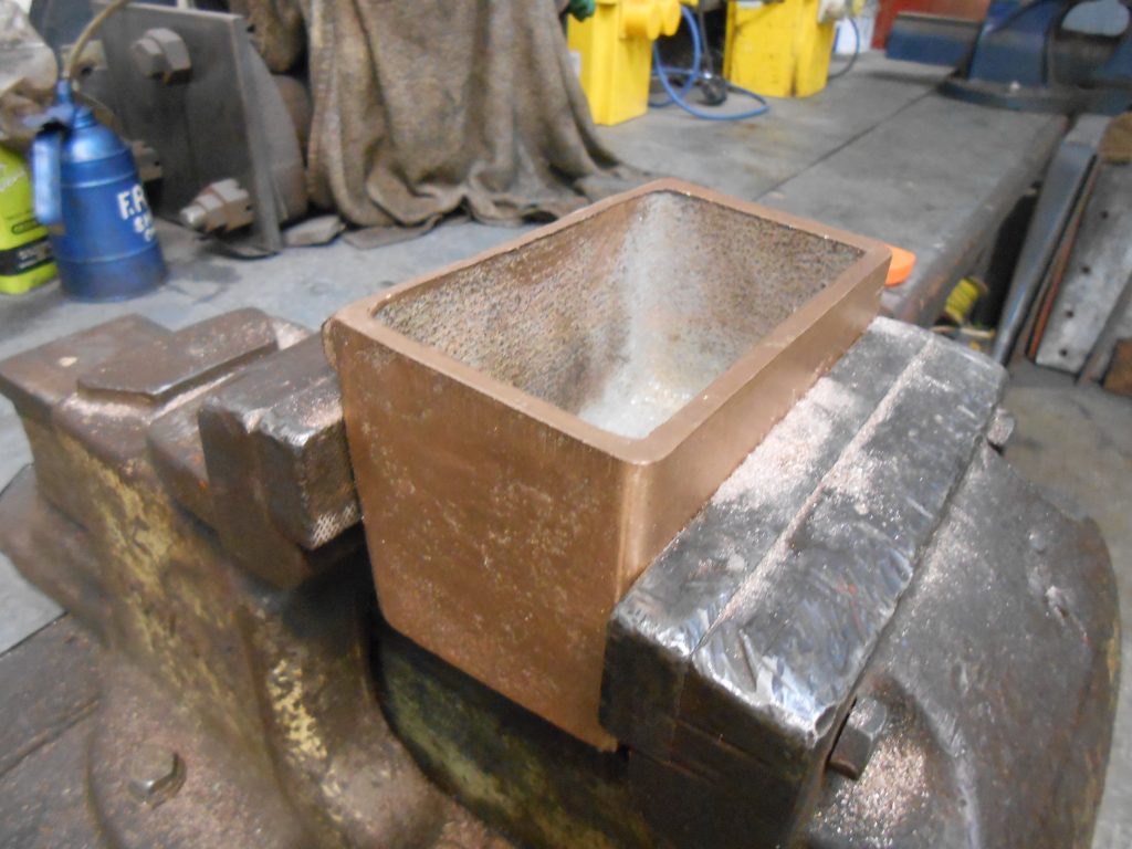 The machined lubrication box for Caliban