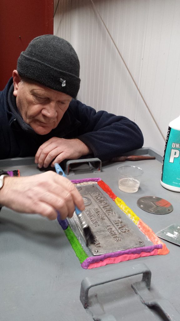 Paul prepares the gas door plate prior to making a mould