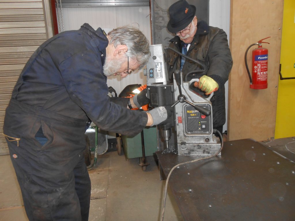 Drilling holes in the new piece of Caliban's running board