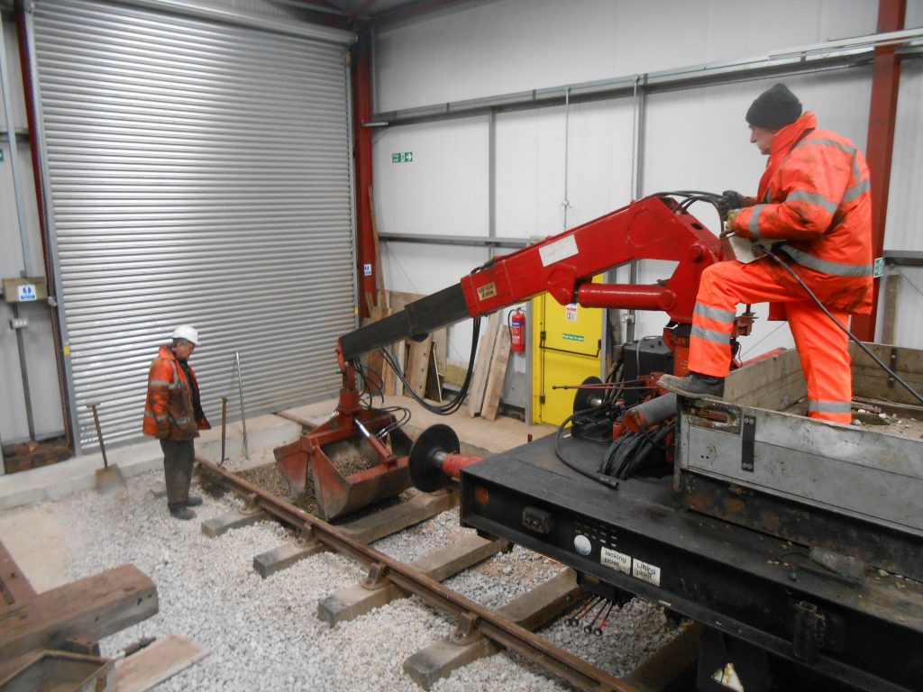 Ballast being dropped on road four