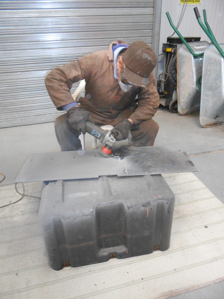 Fred at work cleaning up the platework