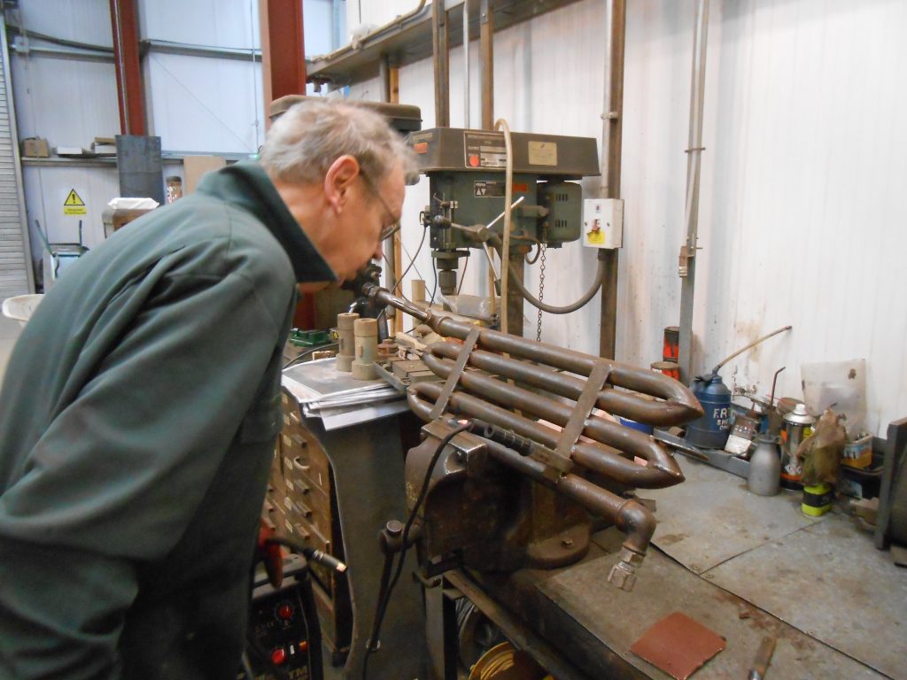 The repair on the heater coil is inspected