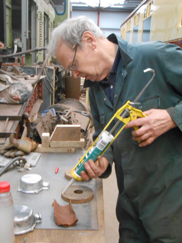 John preparing one of the lighting connector pattresses for fitting