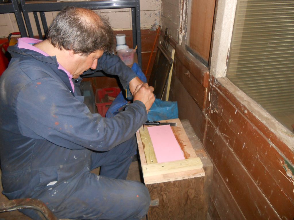 Mike unscrewing the mould frame
