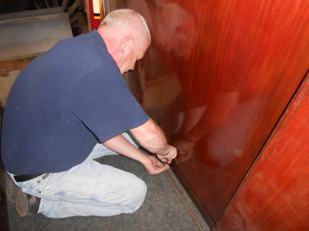 Paul fixing a door runner