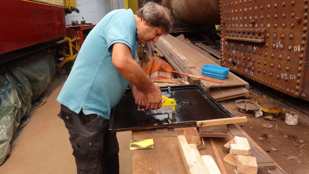 Mike rivetting the gas box sign