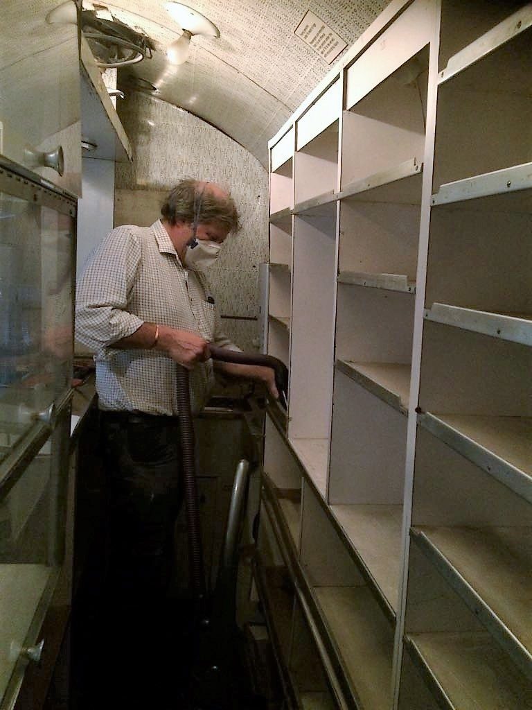 Mike vacuuming the buffet shelves