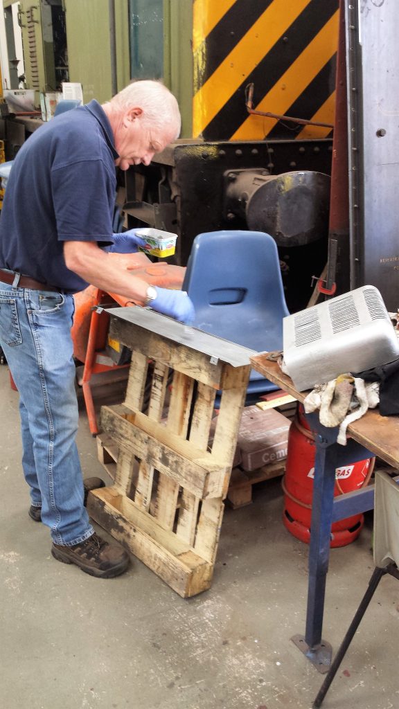 Paul painting one of the heater guards