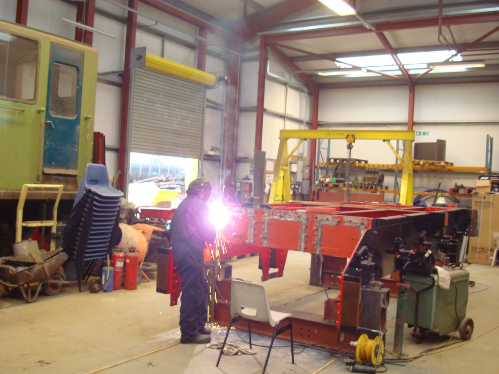 John Stewart welding Wootton Hall's tender frames