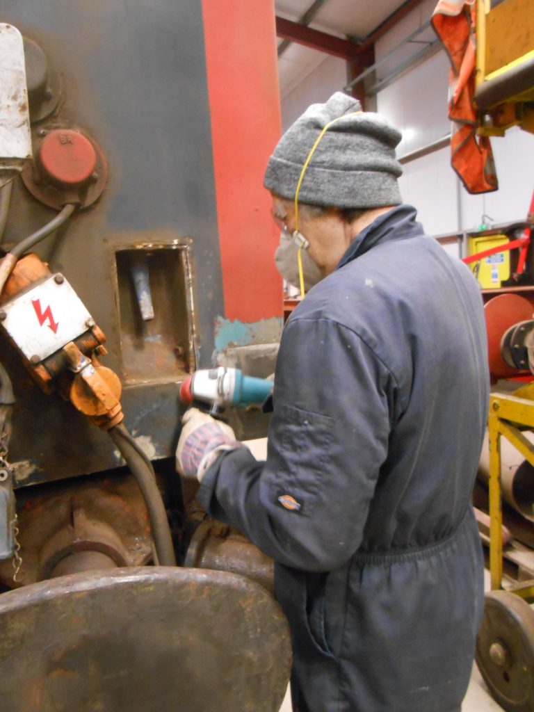 Mike Rigg attends to one of the water filler indents on the TPO