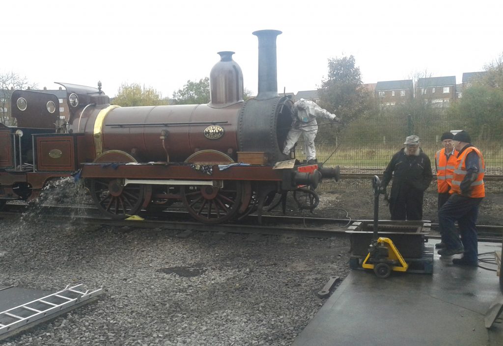 Water is discharged from the boiler as Fred cleans out the tubes