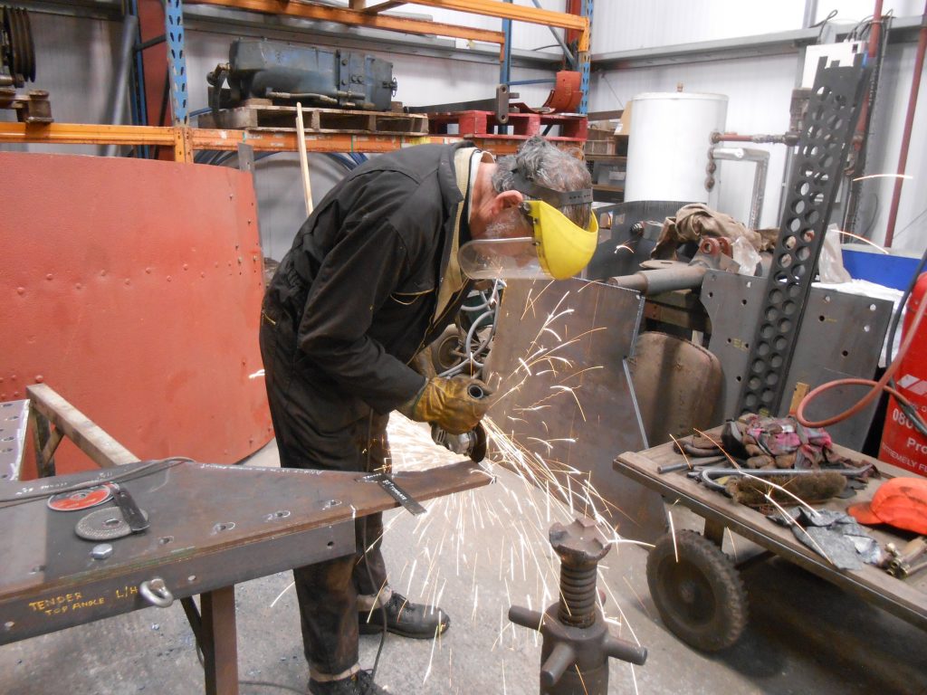 Keith skimming metal from a new piece of steel plate for Wootton Hall