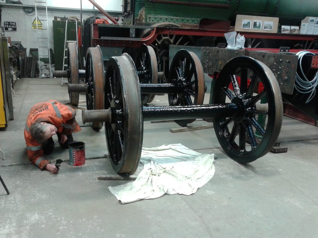 Keith maiking sure that all areas of the tender wheels are covered with black paint