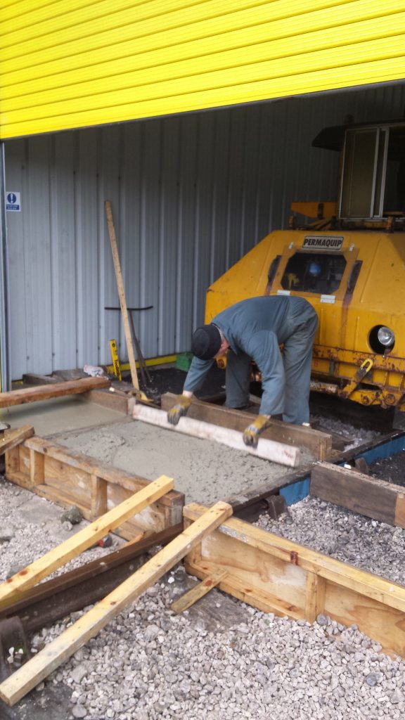 John Dixon levelling off the concrete