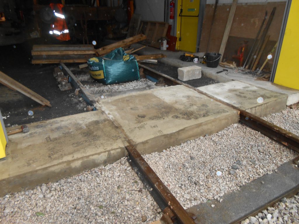 The concrete under the east end shed doors is now complete