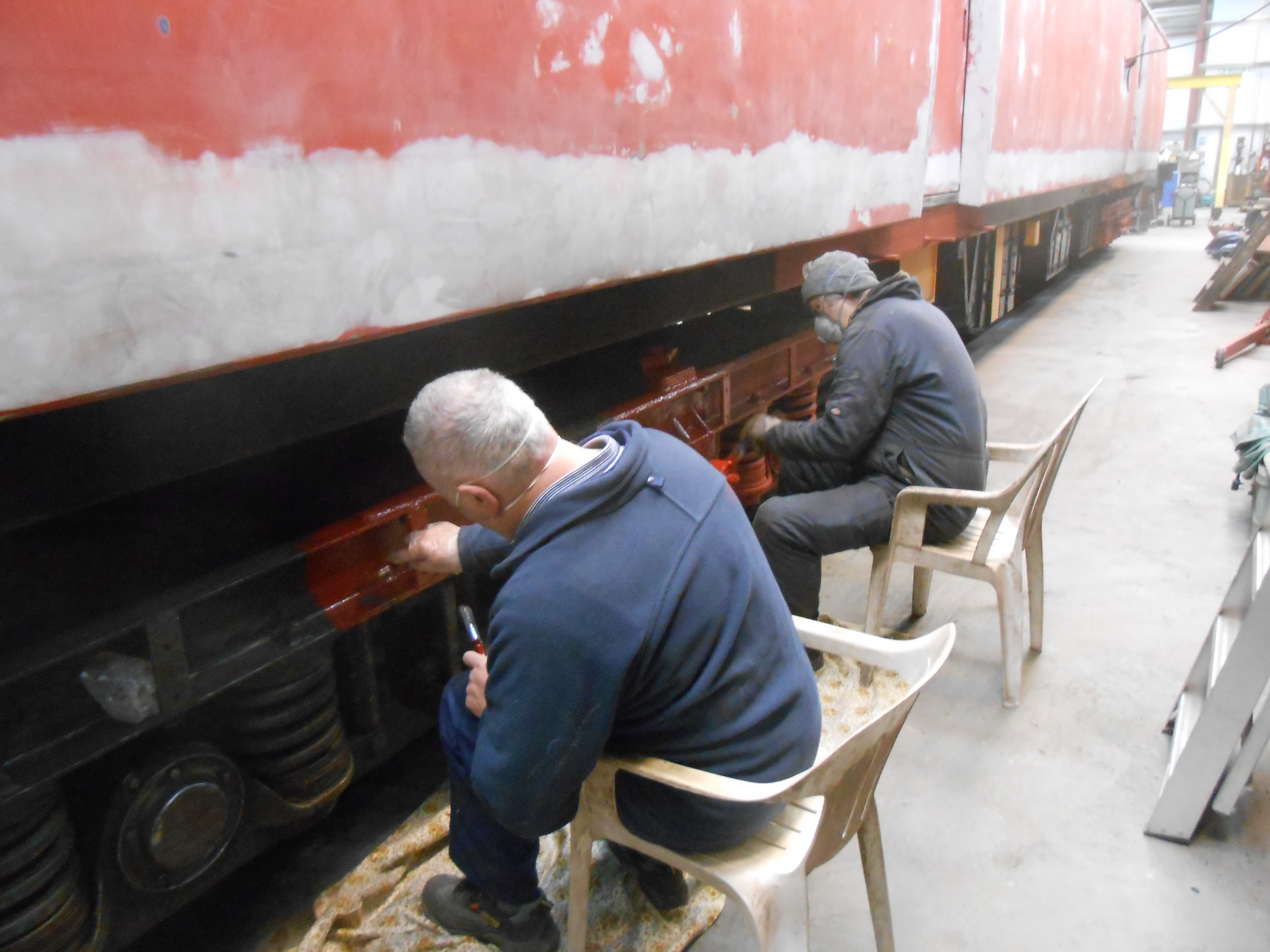 John Davis and Mike Rigg painting one of the TPO bogies