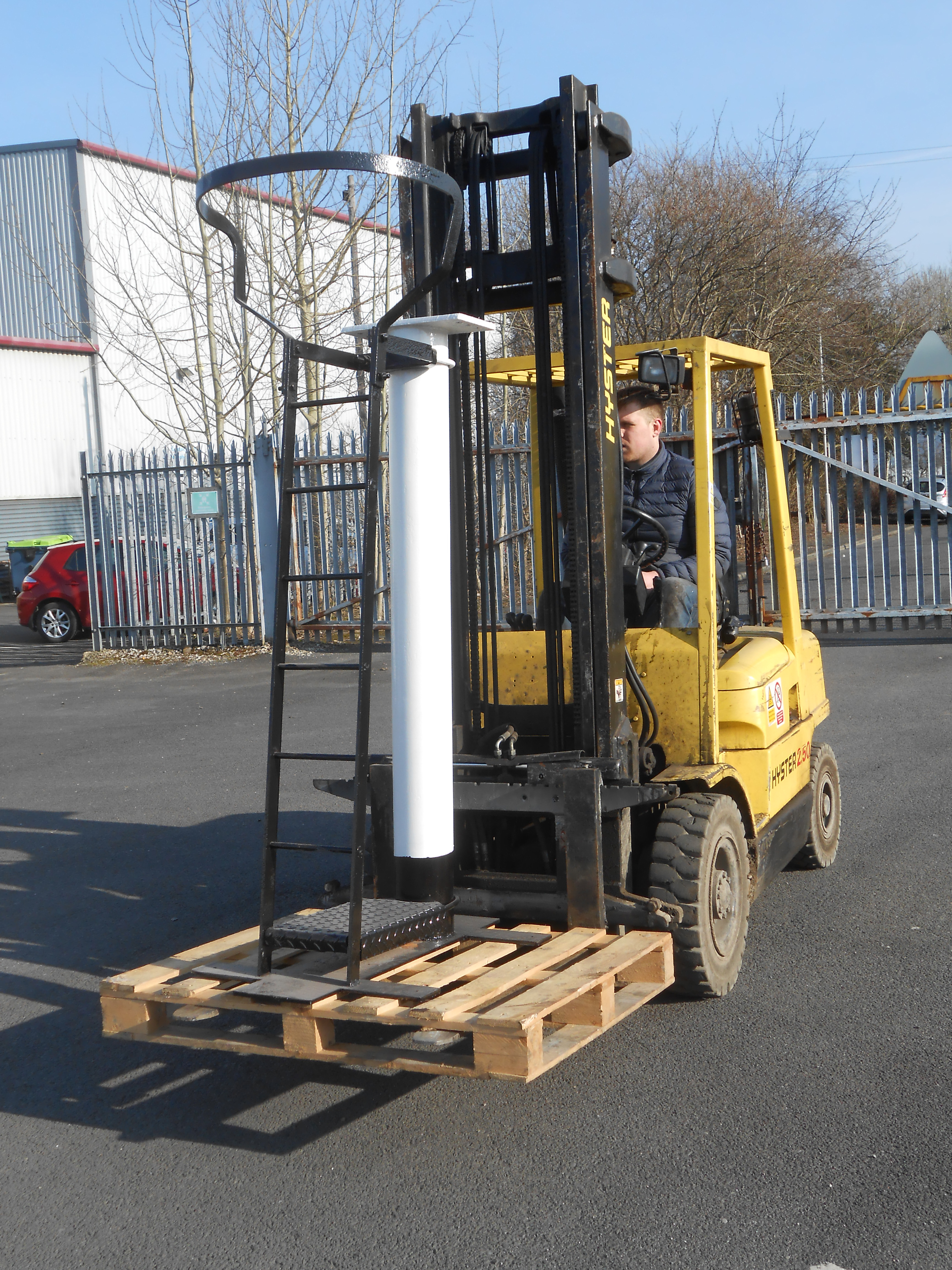 Matt Bedford moves the restored signal post towards the Museum