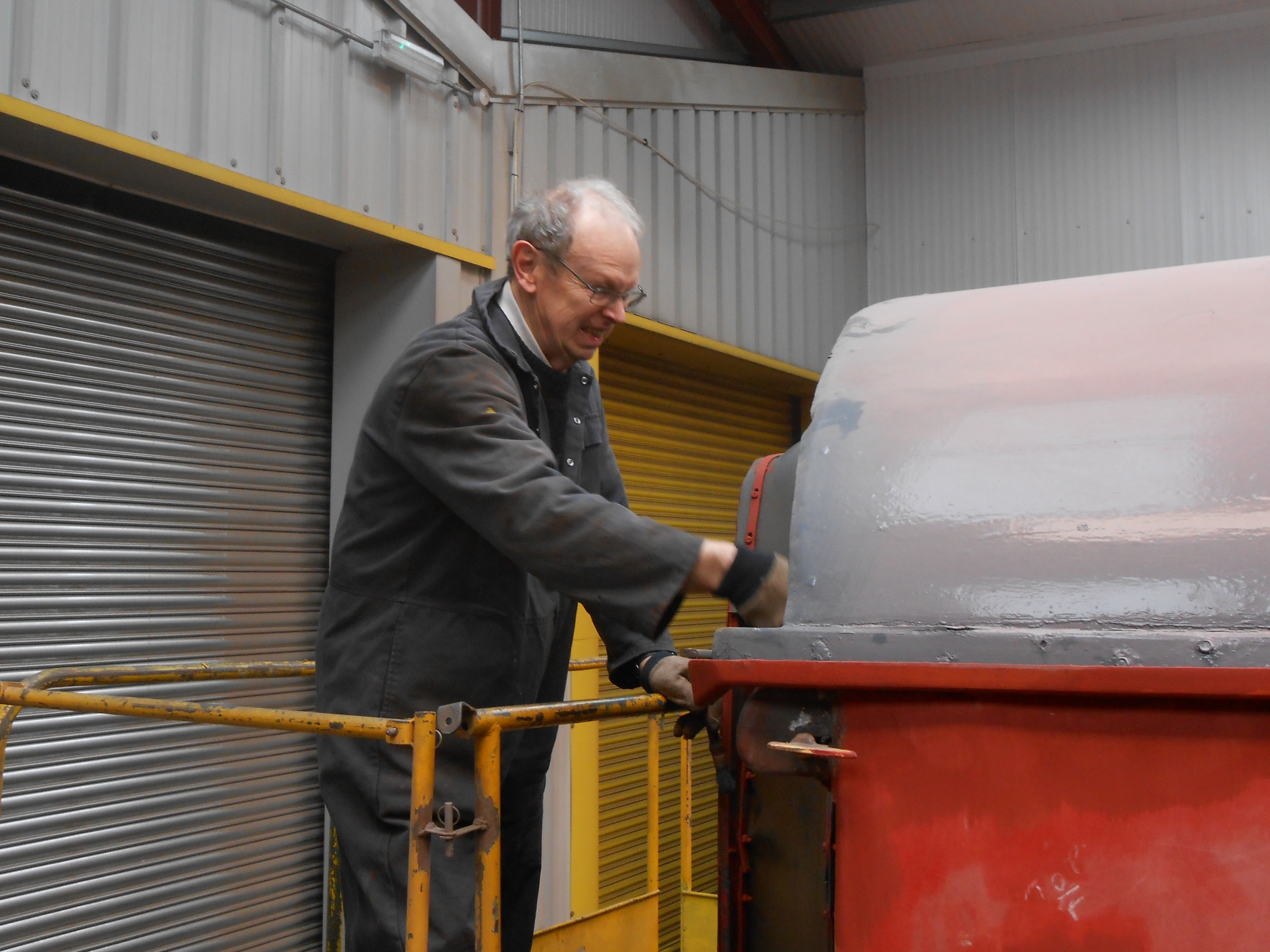 John Dixon painting the corridor end of the TPO coach