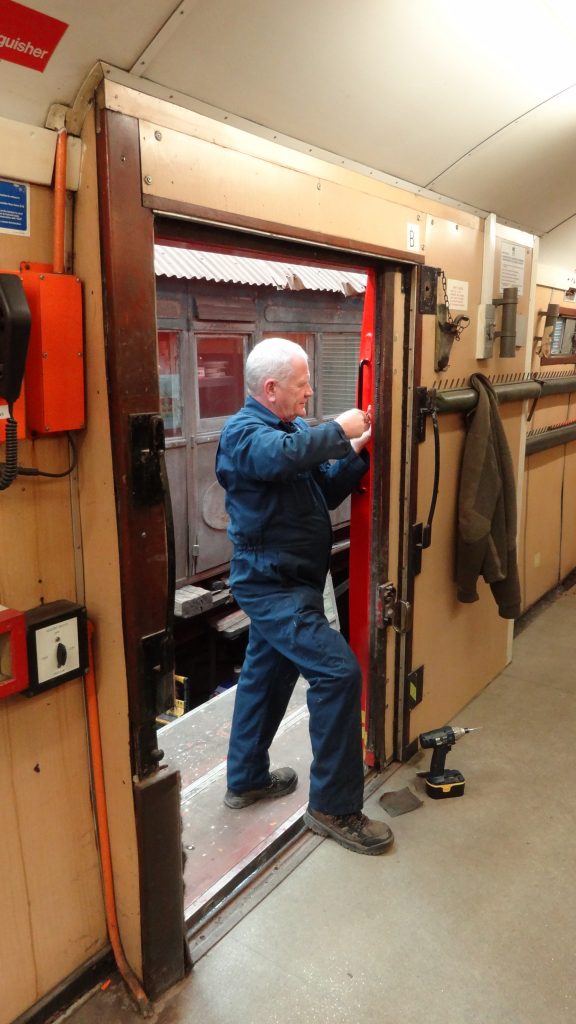 Paul Newton screws in a brush strip on the TPO