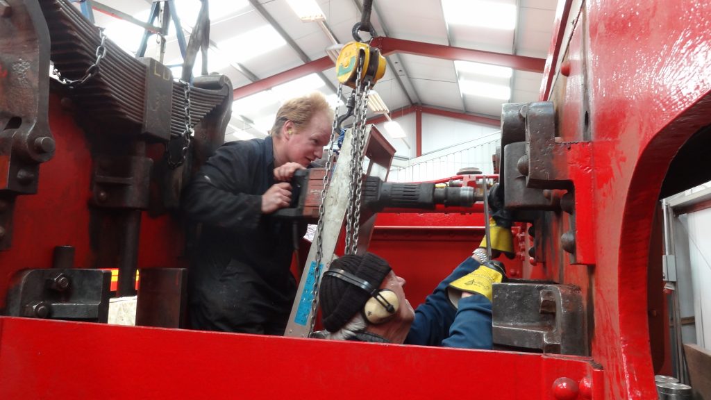 Chris Rycroft and Howard Fletcher line up the jack hammer to try and remove one of Caliban's spring hanger pins. 180418