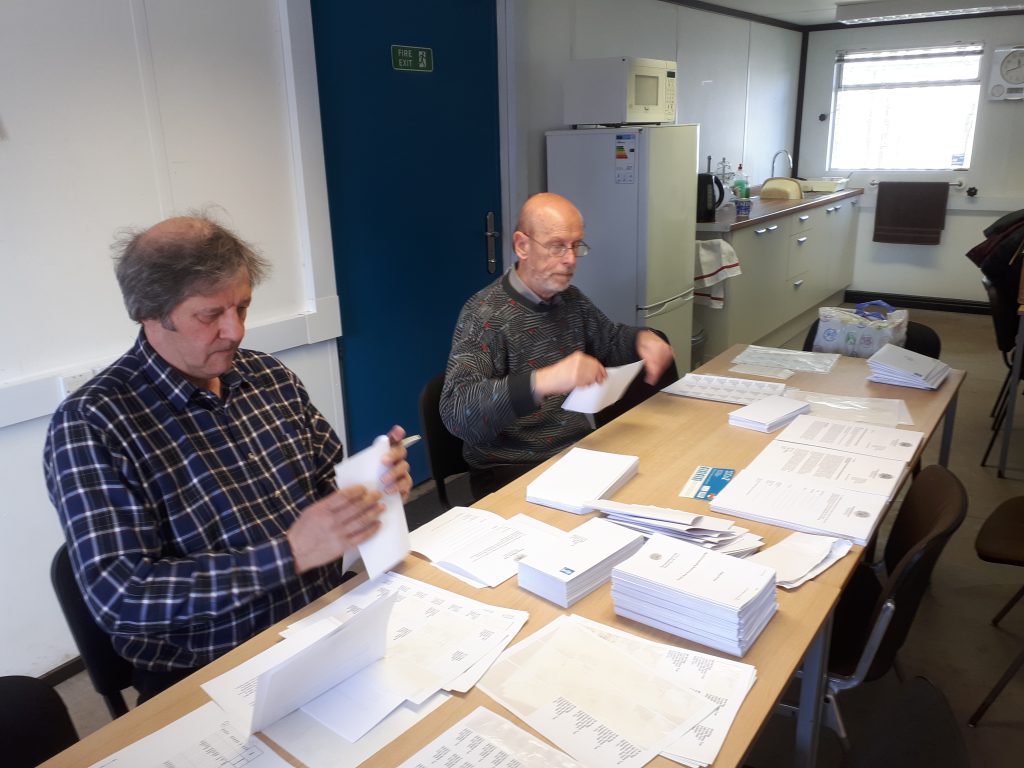 Mike Rigg and David Rimmer hard at it in the mess room stuffing envelopes with the GDPR info