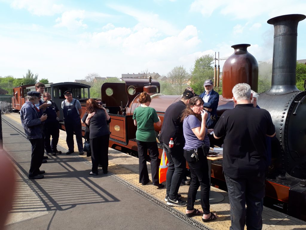 Staff and volunteers at Locomotion attack the cakes before FR 20's final two runs at Shildon on Monday, 7th May