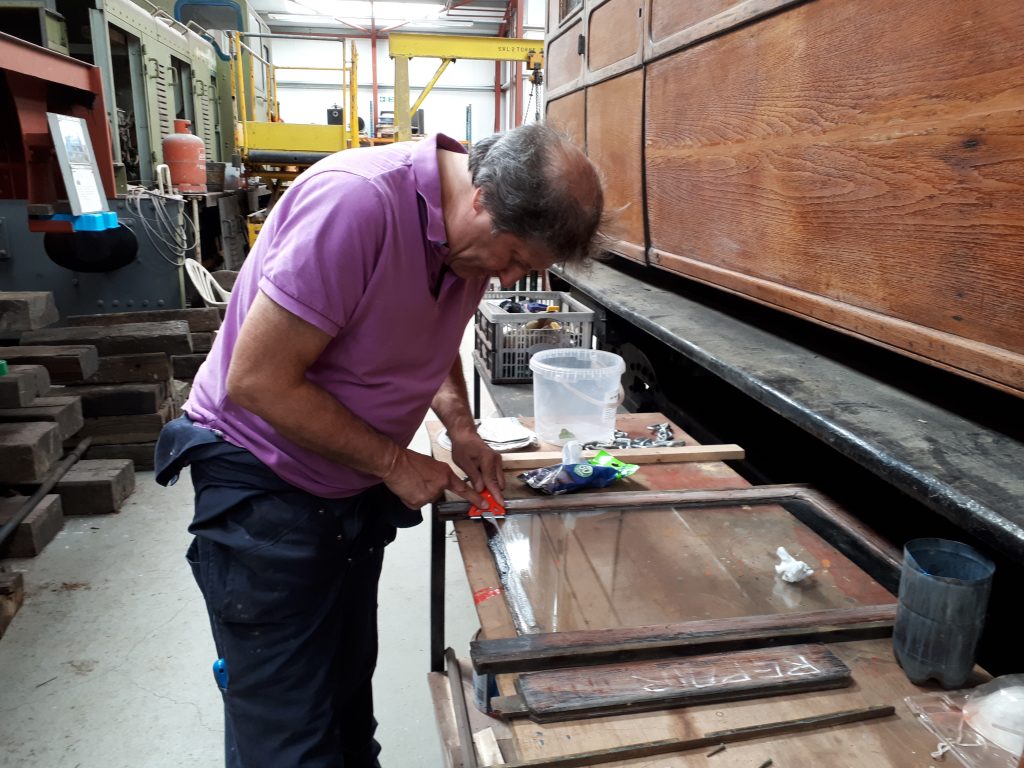 Mike Rigg repairing a window frame from GER 5