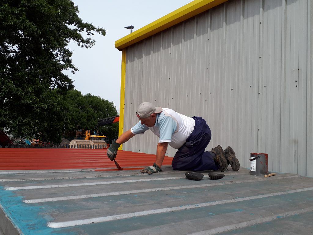 John Davis painting the mess room roof