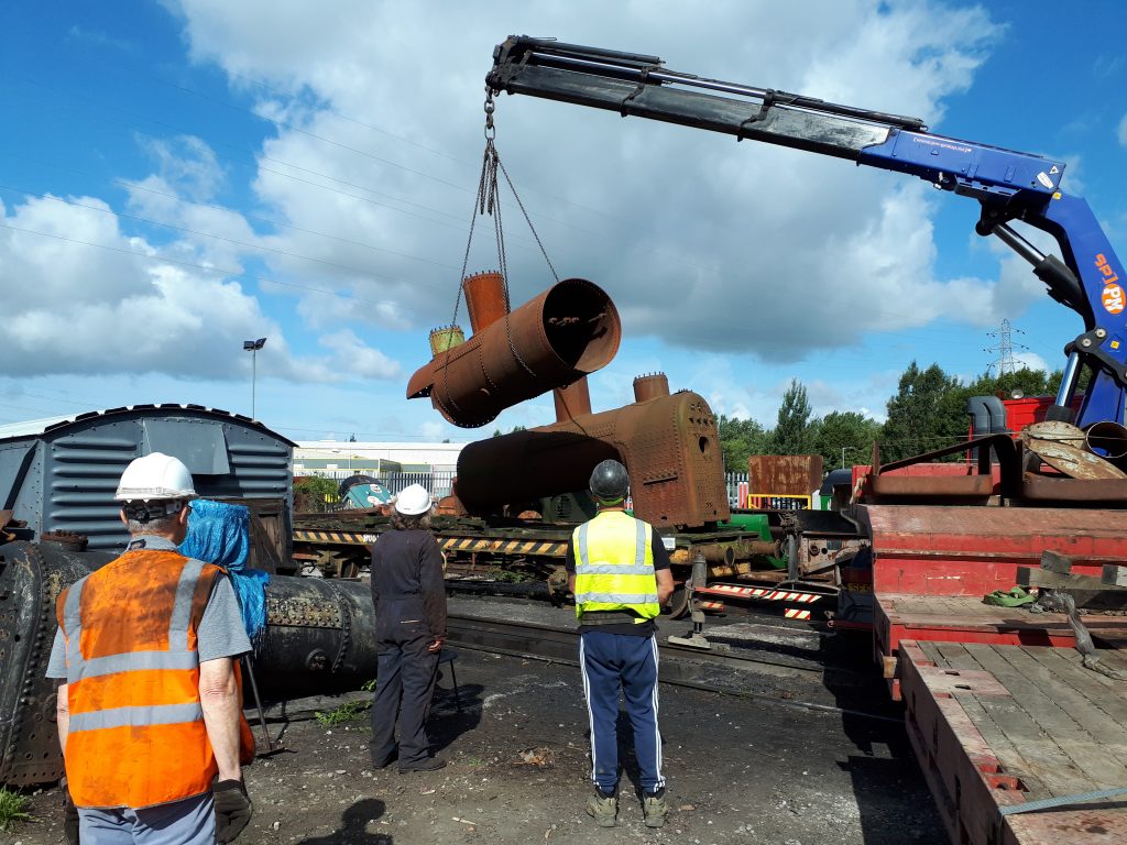 Fr 25's boiler is lifted into position on the FR bogie bolster 010818