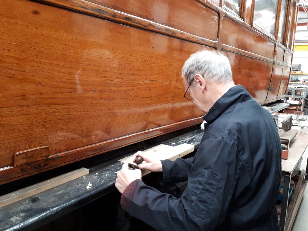 John Dixon panes new wood on one of GER No. 5's step boards