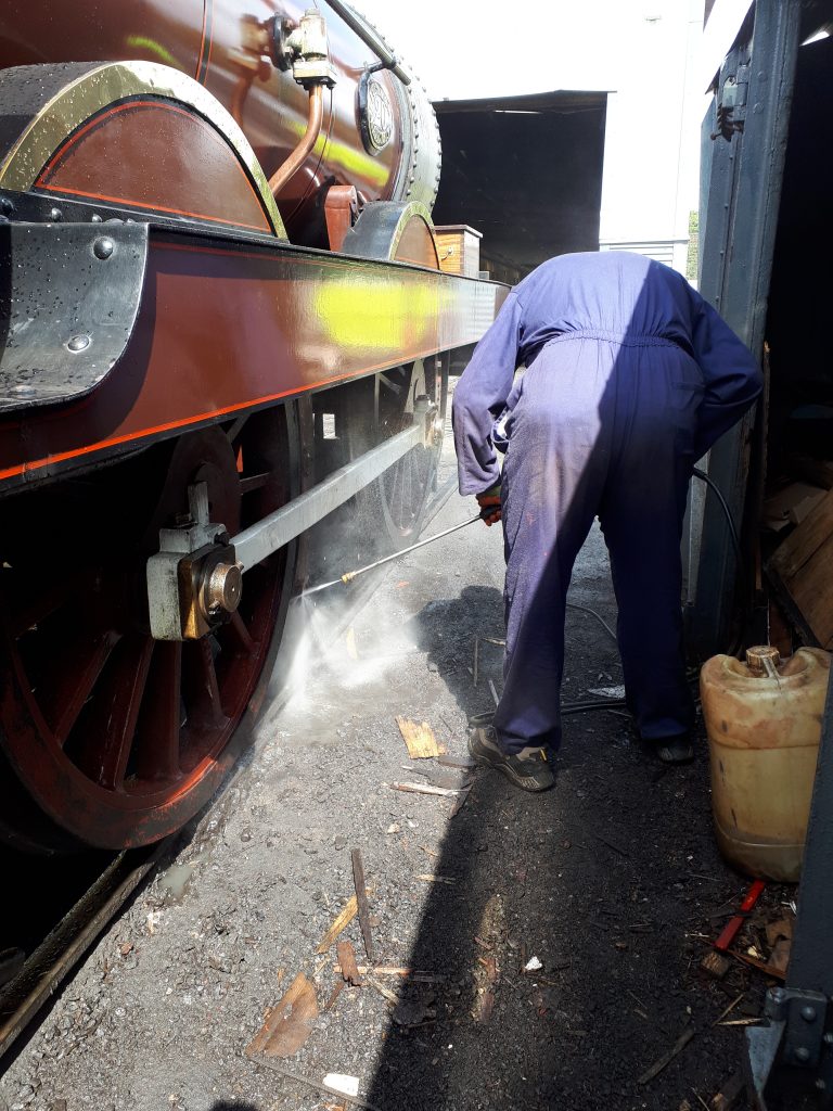 John Davis power washes FR 20's wheels