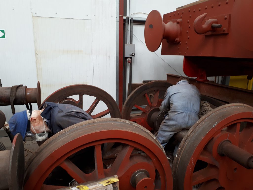 Fred and Roger cleaning up Caliban's wheels