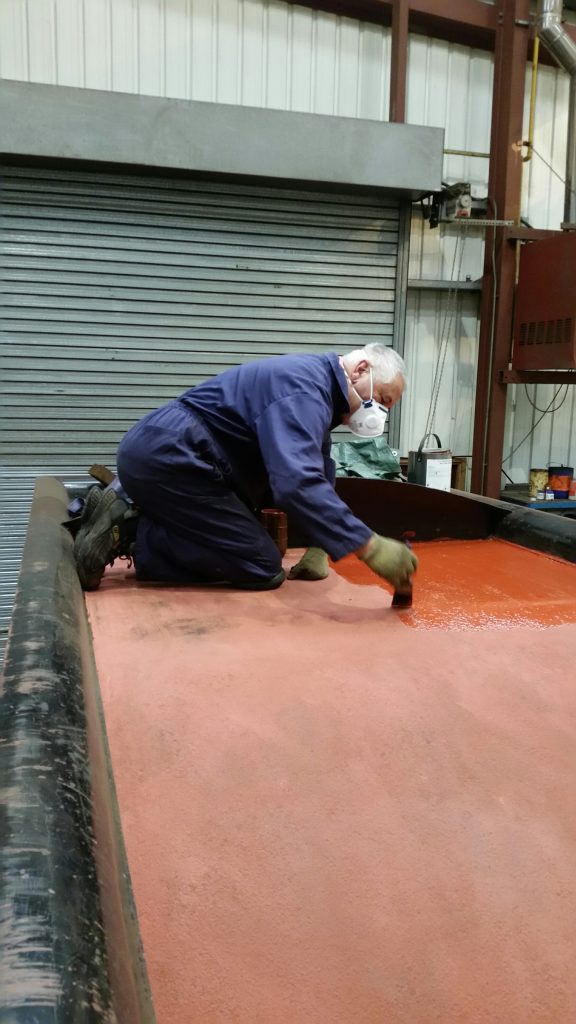 John Davis giving a second coat of primer to FR 20's tender coal space