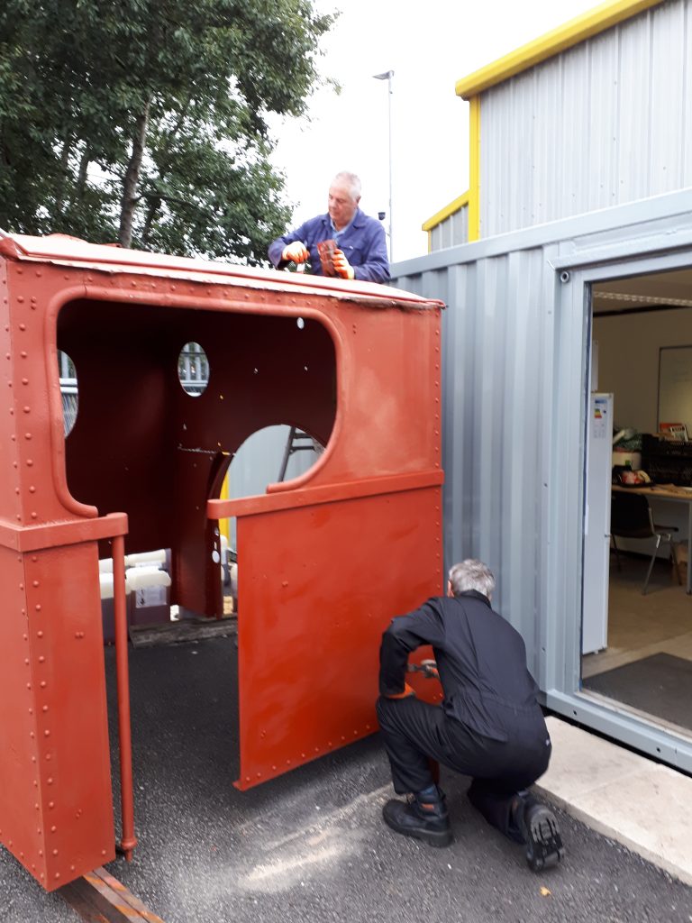 Paul Balshaw and John Davis put red oxide on Caliban's cab