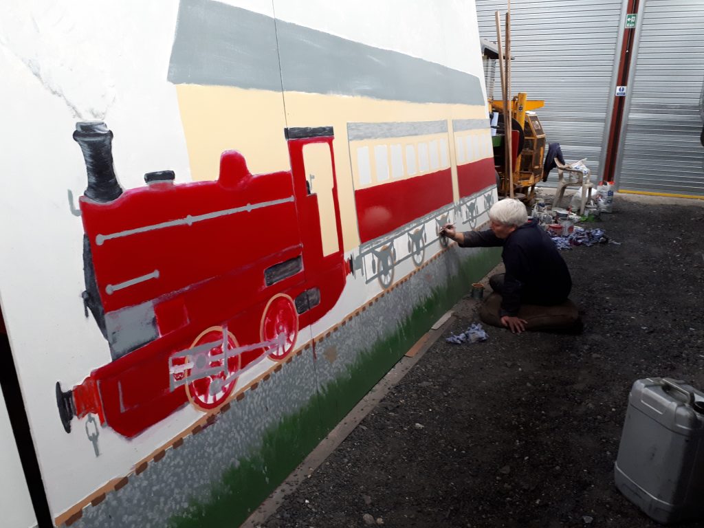 Bill Croston at work on the mural