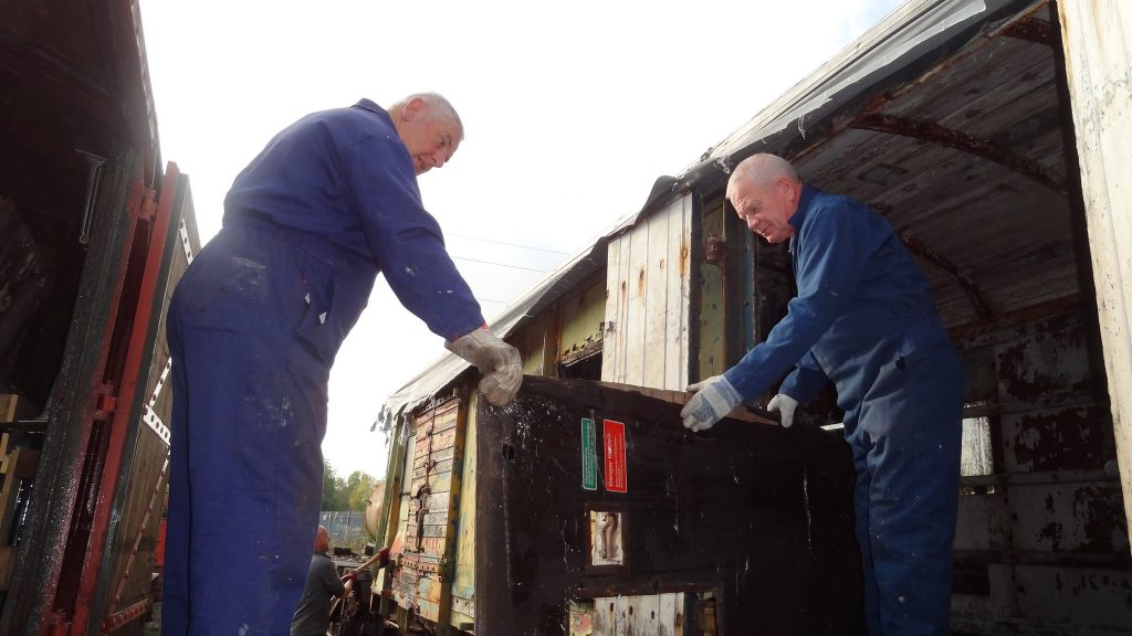 John Davis and Paul Newton emptying the PMV