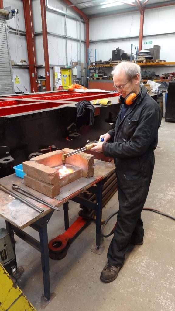 John Dixon heating up a rivet