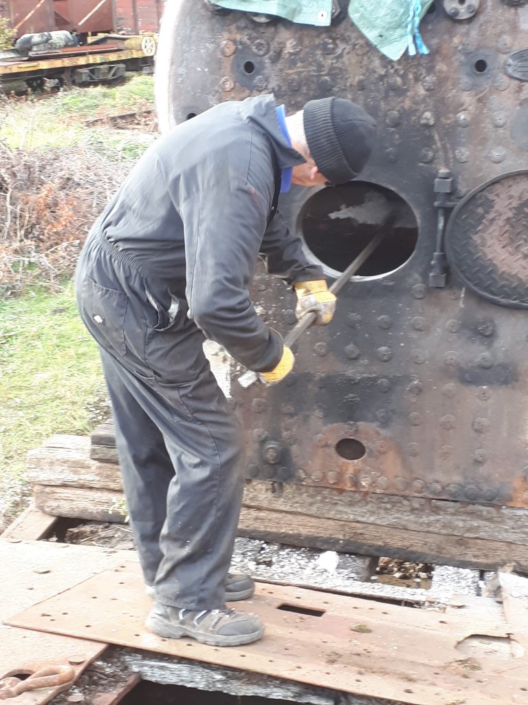 John Dixon prods a stubborn brick arch in FR 20's firebox