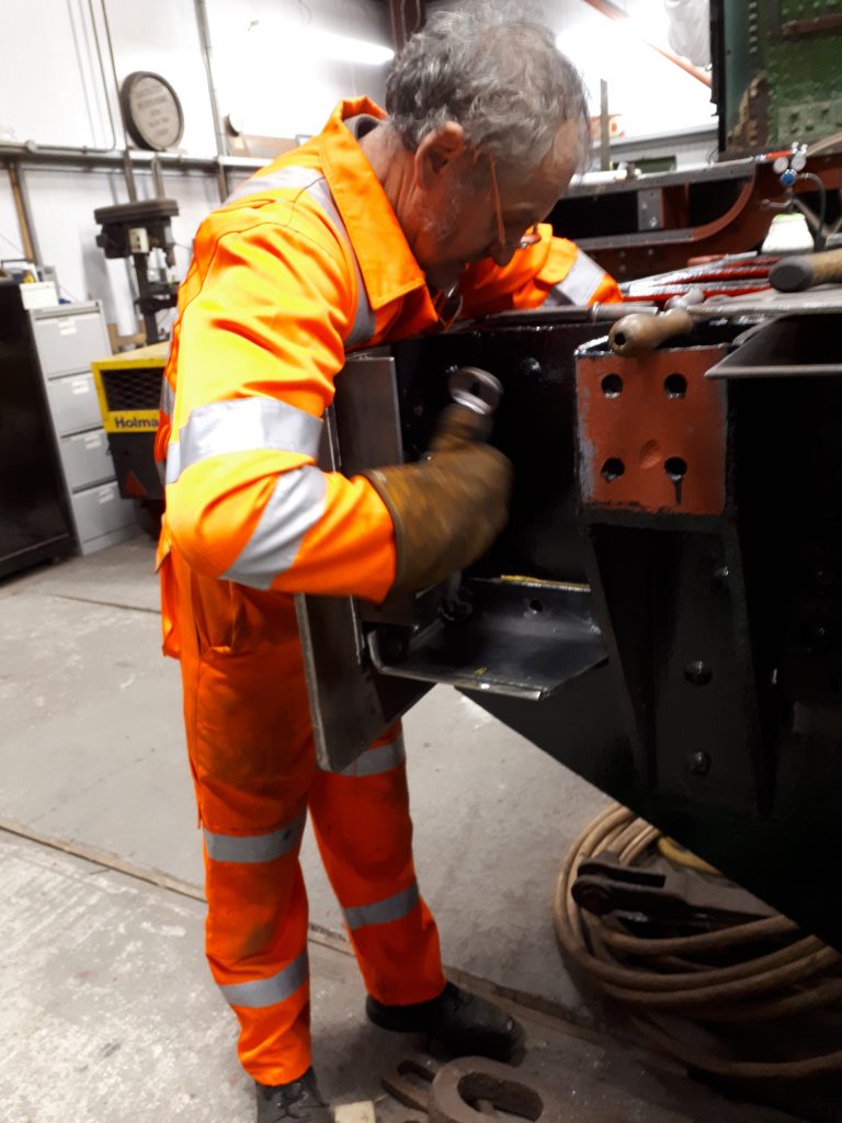 Keith bolts on the tender steps fixing plate.