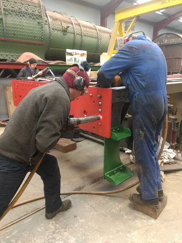 Matt and Keith finish another rivet while John gets the next one ready