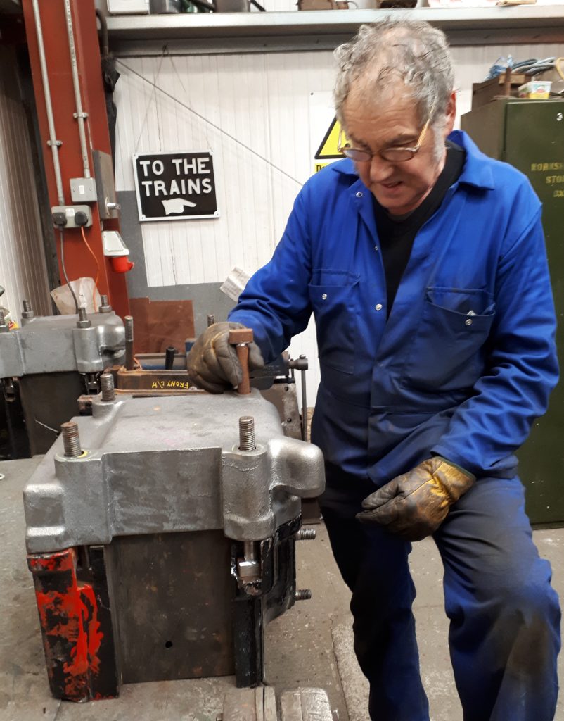 Keith fits one of Wootton Hall's new tender axle box keeps to an axle box