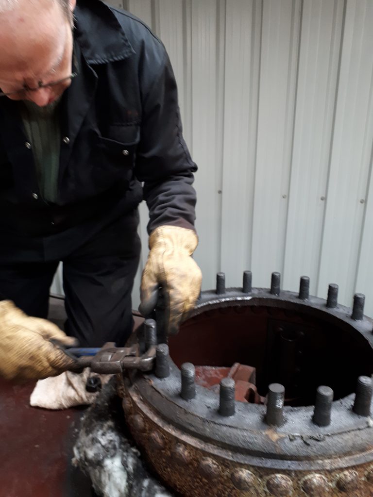 John Dixon replace a loose stud on Cumbria's dome