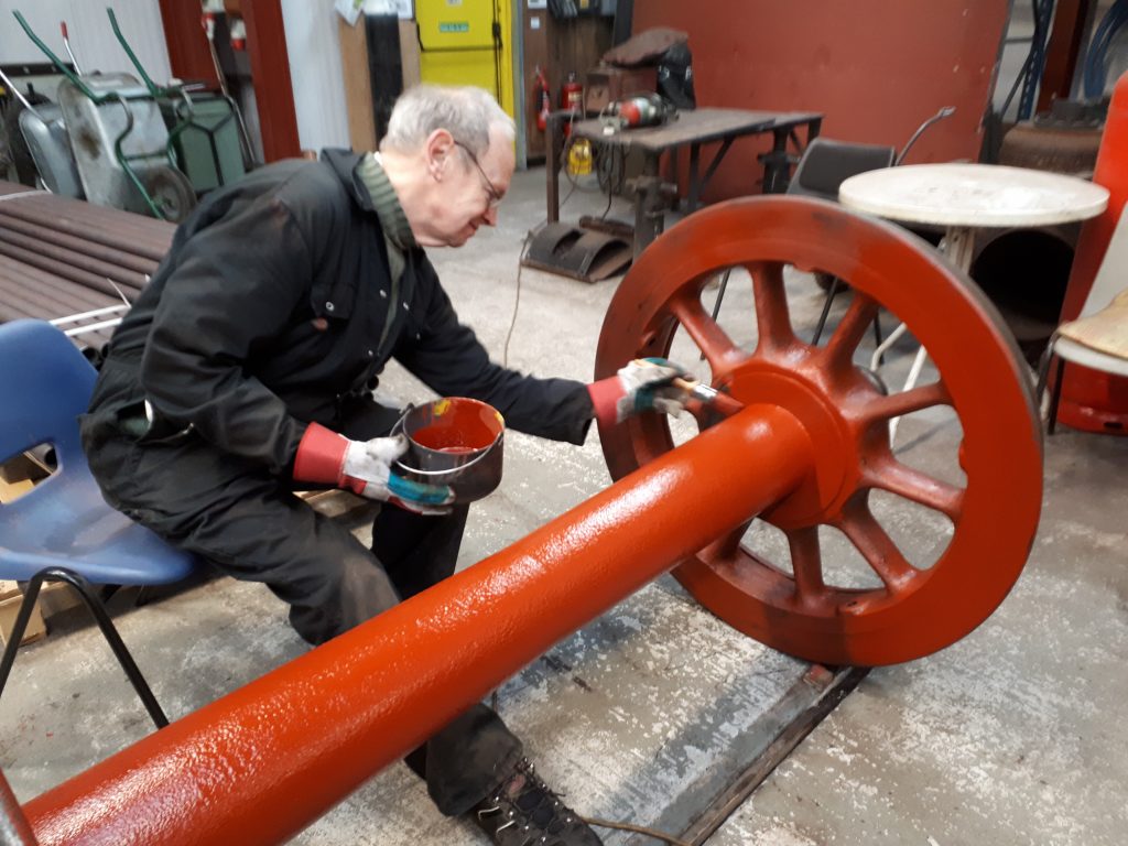 Happy in his work. John Dixon paints one of Fr 20's tender wheelsets