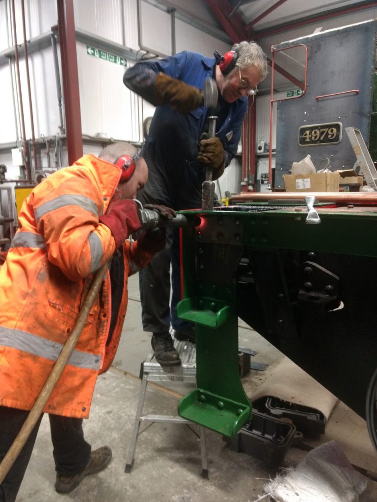 Matt Jervis applies the riveting gun to the last rivet