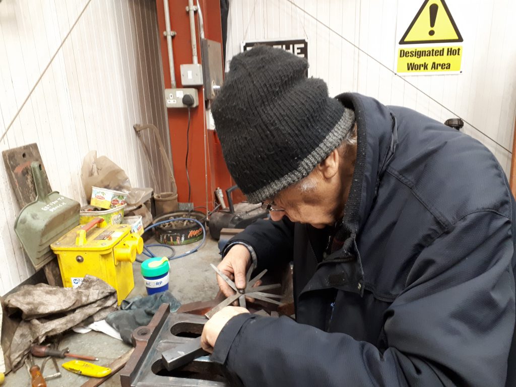 Bob uses a feeler gauge to check progress with work on Cumbria's regulator valve