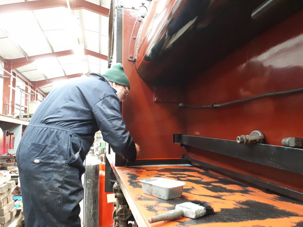 Phil Bell starts the job of undercoating Cumbria's running board