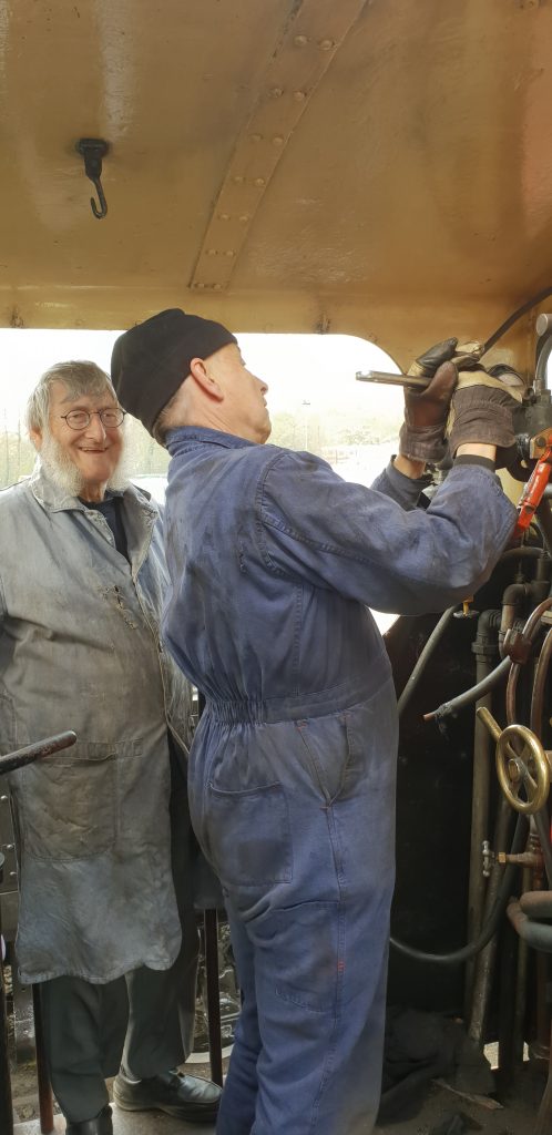 Tim tightens the steam brake pipe to Cumbria's manifold