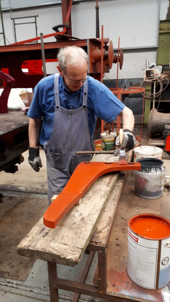 John applies primer to one of FR 20's guard irons